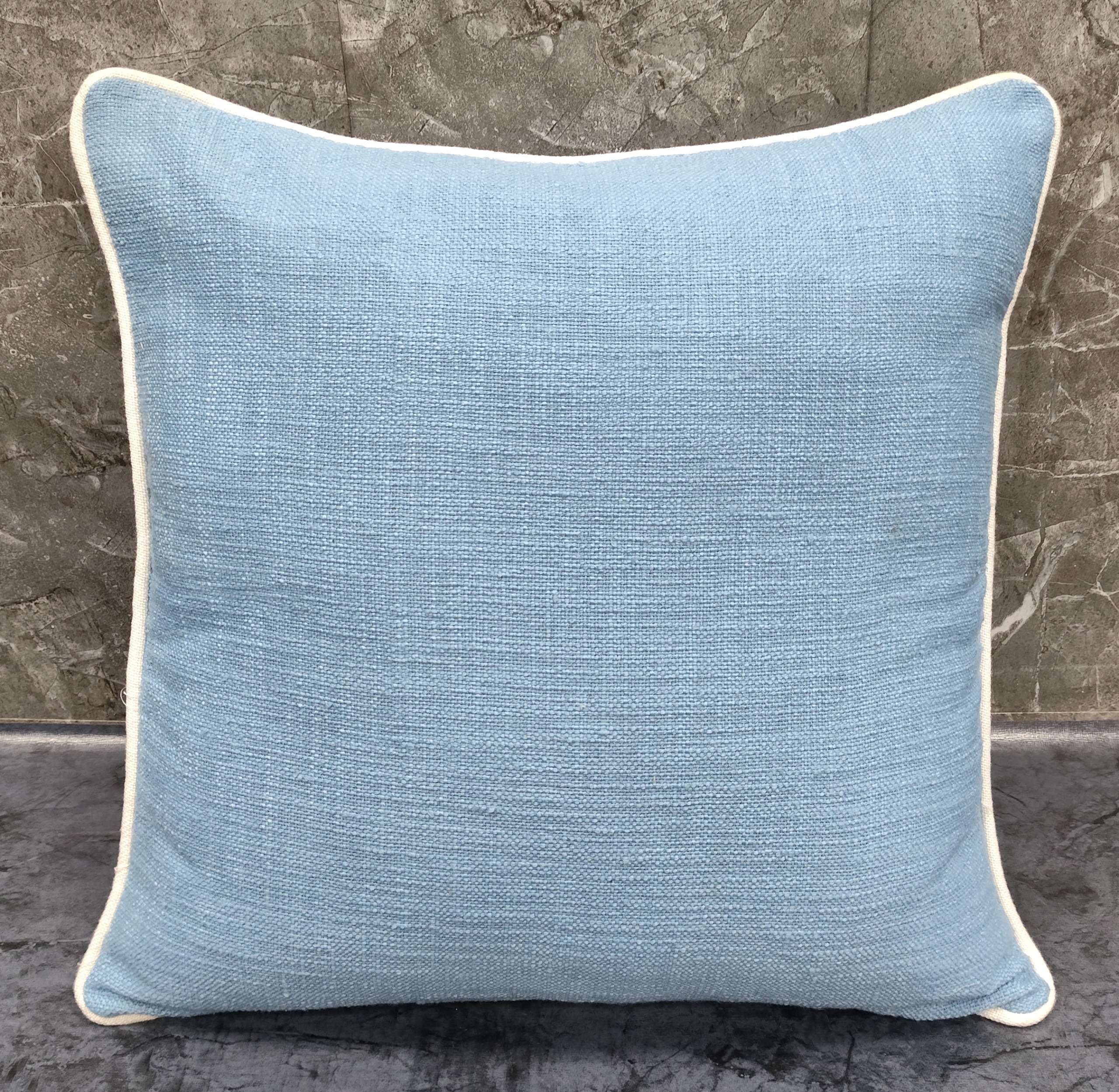 Pillow | Slub Woven Cushion in soft blue color with white trim, ideal for enhancing home décor.