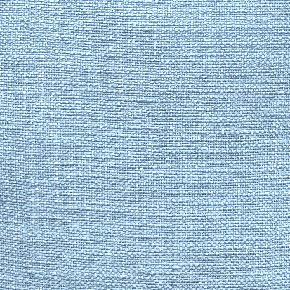 Pillow cover fabric texture in soft blue, showing elegant slub woven design for home décor.