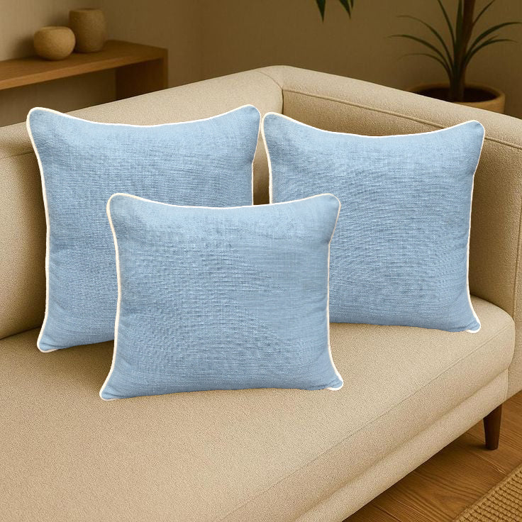Elegant blue pillow set on a couch, perfect for enhancing home décor with a slub woven design.