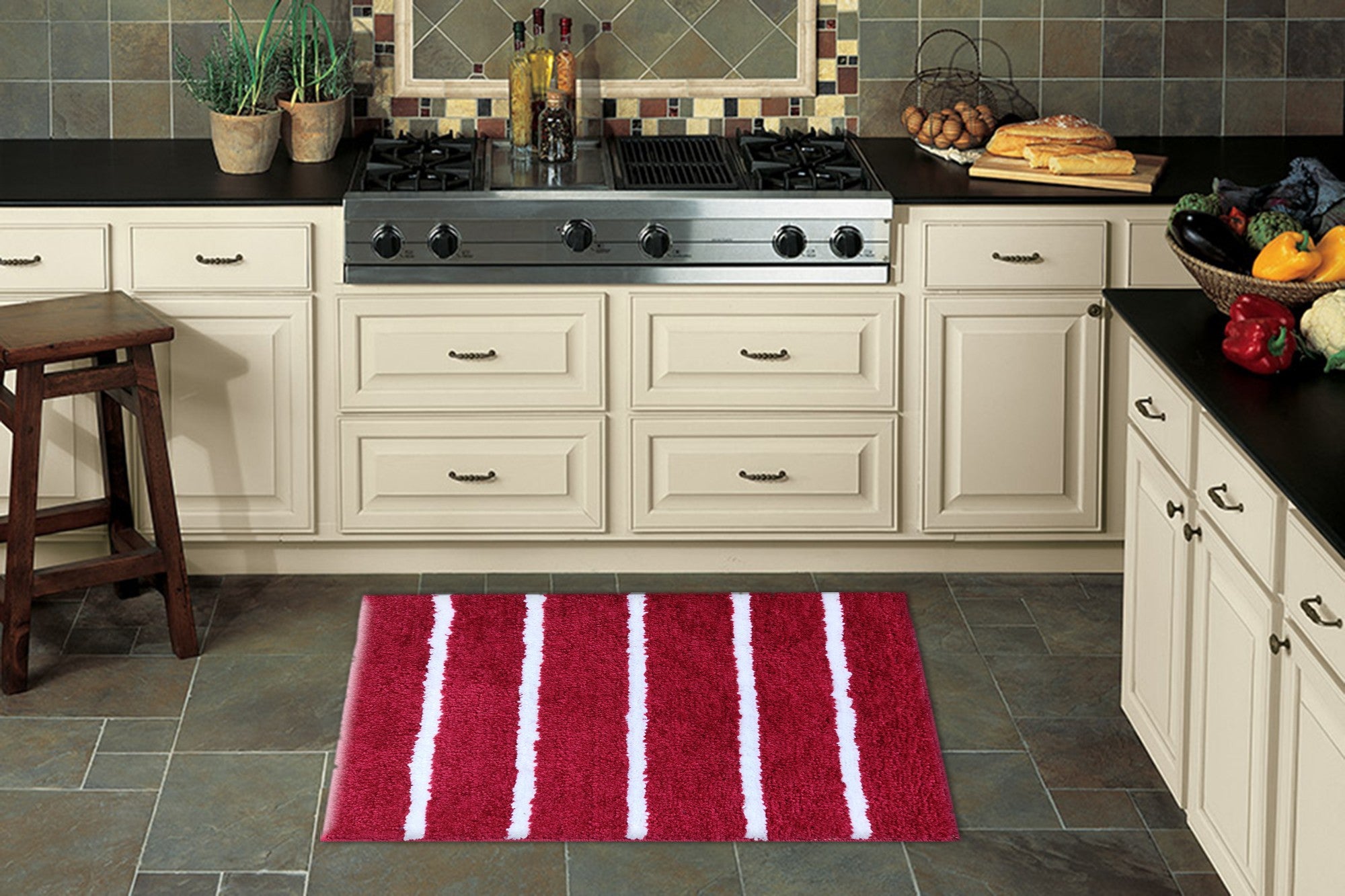 Modern Rug in a kitchen setting featuring a red microfiber stripe bathmat on slate flooring